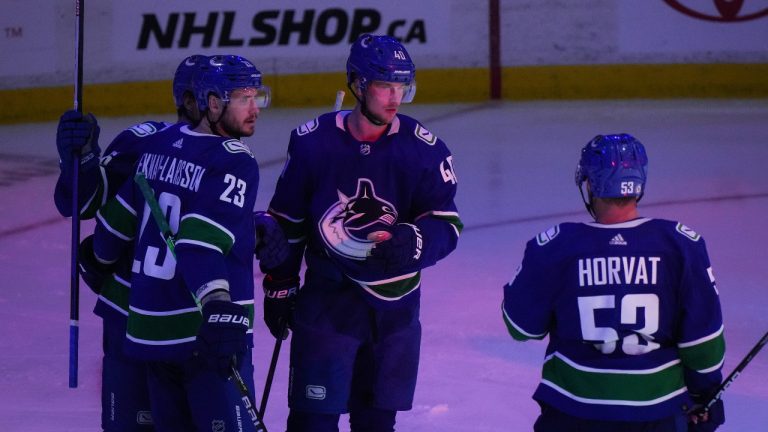 Vancouver Canucks' Elias Petterson (40), of Sweden, Oliver Ekman-Larsson (23), of Sweden, and Bo Horvat celebrate Petterson's first goal against the Edmonton Oilers during the third period of a pre-season NHL hockey game in Abbotsford, B.C. (Darryl Dyck/CP)