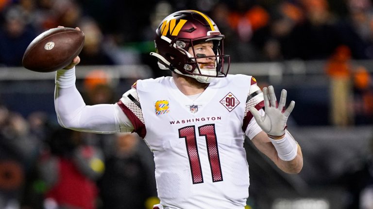 Washington Commanders quarterback Carson Wentz throws against the Chicago Bears in the first half of an NFL football game in Chicago, Thursday, Oct. 13, 2022. (Nam Y. Huh/AP)