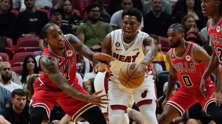 Chicago Bulls forward DeMar DeRozan (11) goes after a pass by Miami Heat guard Kyle Lowry (7) during the first half of an NBA game Wednesday, Oct. 19, 2022, in Miami. (Marta Lavandier/AP)