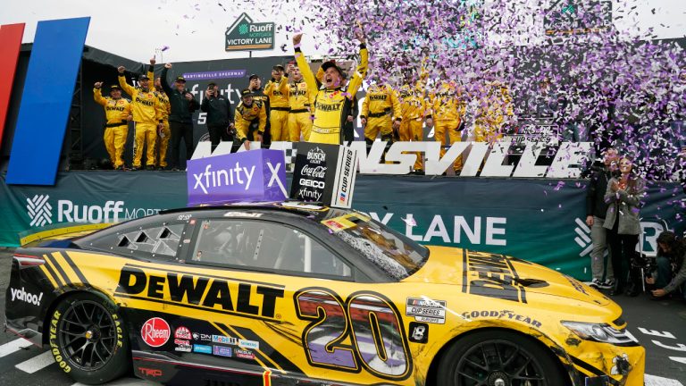 Christopher Bell (20) celebrates in Victory Lane after winning a NASCAR Cup Series auto race at Martinsville Speedway, Sunday, Oct. 30, 2022, in Martinsville, Va. (Chuck Burton/AP)