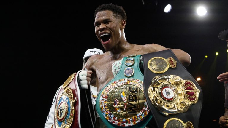 United States' Devin Haney displays his belts after defeating George Kambosos Jr. of Australia as Haney defends his undisputed lightweight boxing title in Melbourne, Sunday, Oct. 16, 2022. (Hamish Blair/AP)