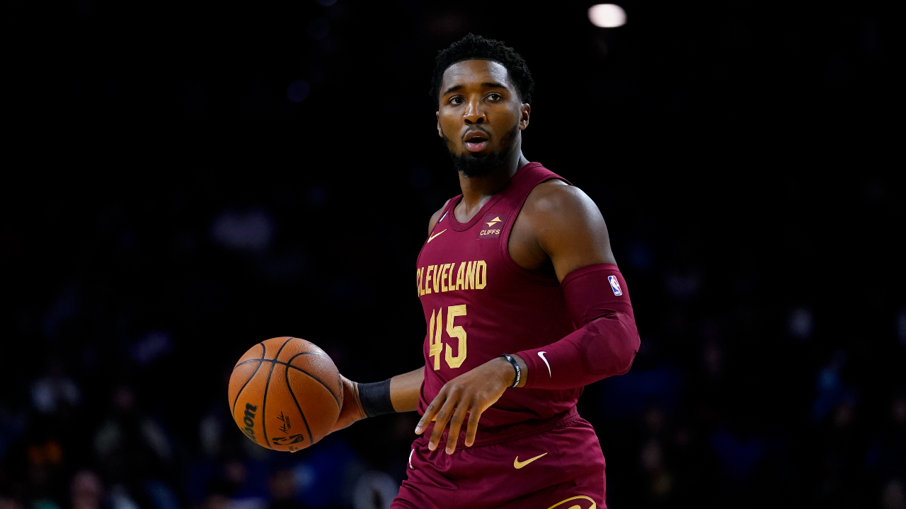 Cleveland Cavaliers' Donovan Mitchell dribbles during the first half of a preseason NBA basketball game against the Philadelphia 76ers, Wednesday, Oct. 5, 2022, in Philadelphia. (AP Photo/Matt Slocum)