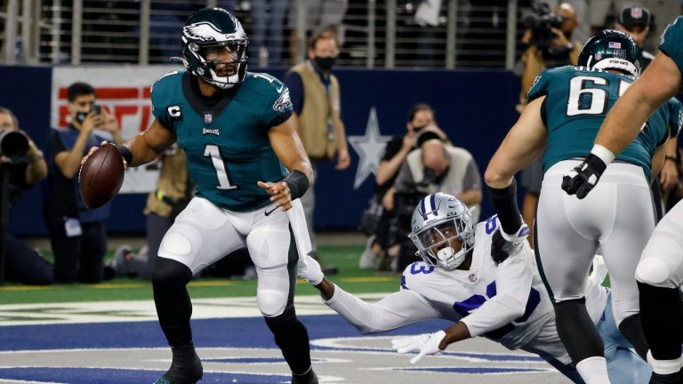 Philadelphia Eagles quarterback Jalen Hurts (1) is pressured behind the line of scrimmage by Dallas Cowboys defensive end Tarell Basham (93) in the first half of an NFL football game in Arlington, Texas, Monday, Sept. 27, 2021. (Michael Ainsworth/AP)