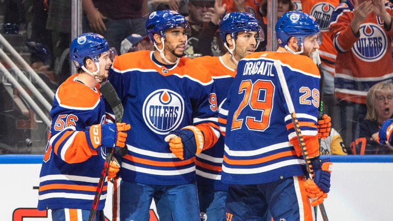 Edmonton Oilers' Kailer Yamamoto (56), Evander Kane (91), Evan Bouchard (2) and Leon Draisaitl (29) celebrate a goal against the Pittsburgh Penguins during second period NHL action in Edmonton on Monday, October 24, 2022. (Jason Franson/CP)