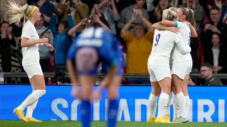 England's Lauren Hemp, second right, celebrates with teammates after scoring her side's opening goal during the women's friendly soccer match between England and the US at Wembley stadium in London, Friday, Oct. 7, 2022. (Kirsty Wigglesworth/AP)