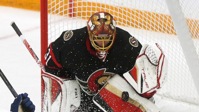 Ottawa Senators goaltender Anton Forsberg (31) makes a save on a shot from Toronto Maple Leafs centre Bobby McMann (74) during second period NHL pre-season action at the CAA arena in Belleville, Ont., on Friday, September 30, 2022. (Lars Hagberg/THE CANADIAN PRESS)