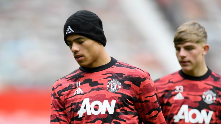 Manchester United's Mason Greenwood, left, and Manchester United's Brandon Williams during warm up before the English Premier League soccer match between Manchester United and Leicester City, at the Old Trafford stadium in Manchester, England, Tuesday, May 11, 2021. (Peter Powell/Pool via AP)