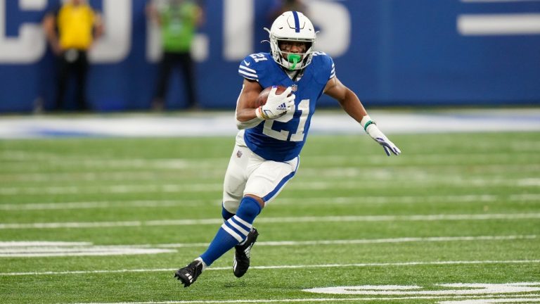 Indianapolis Colts' Nyheim Hines (21) runs with the ball during the second half of an NFL football game against the Tampa Bay Buccaneers, Sunday, Nov. 28, 2021, in Indianapolis. (AJ Mast/AP)