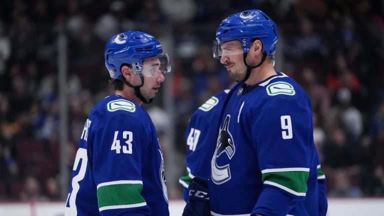 Vancouver Canucks' Quinn Hughes, left, and J.T. Miller. (Darryl Dyck/CP)