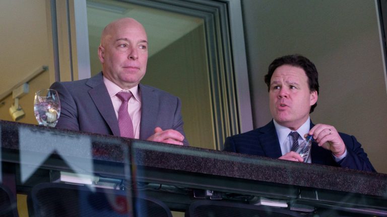 Montreal Canadiens general manager Kent Hughes, left and vice-president Jeff Gorton watch their team face the Florida Panthers during third period NHL hockey action in Montreal on Friday, April 29, 2022. (Paul Chiasson/CP)