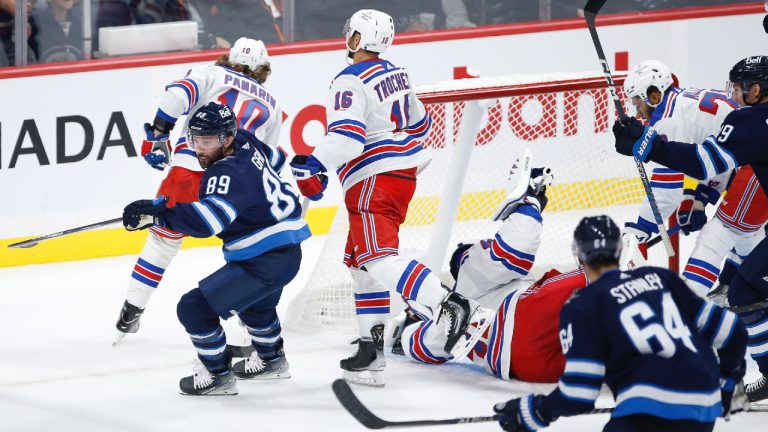 Winnipeg Jets' Sam Gagner (89) scores against New York Rangers goaltender Jaroslav Halak (41) during third period NHL action in Winnipeg, Friday, October 14, 2022. (John Woods/CP)