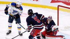 Jets soar past Blues as Hellebuyck nets shutout