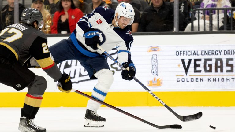 Winnipeg Jets center David Gustafsson (19) shoots against Vegas Golden Knights defenseman Shea Theodore (27) during the first period of an NHL hockey game, Sunday, Oct. 30, 2022, in Las Vegas. (Ellen Schmidt/AP)