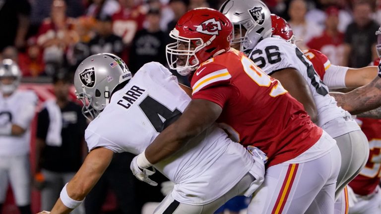 Las Vegas Raiders quarterback Derek Carr (4) is sacked by Kansas City Chiefs defensive tackle Chris Jones, right, during the first half of an NFL football game Monday, Oct. 10, 2022, in Kansas City, Mo. (Ed Zurga/AP Photo)