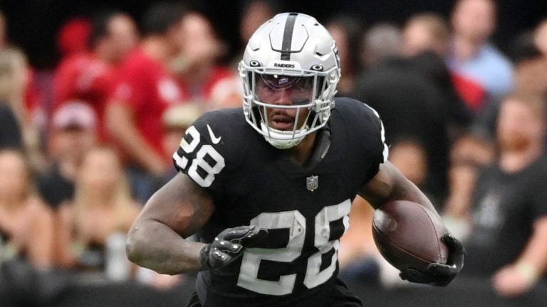 Las Vegas Raiders running back Josh Jacobs runs with the ball during the first half of an NFL football game against the Houston Texans, Sunday, Oct. 23, 2022, in Las Vegas. (David Becker/AP)