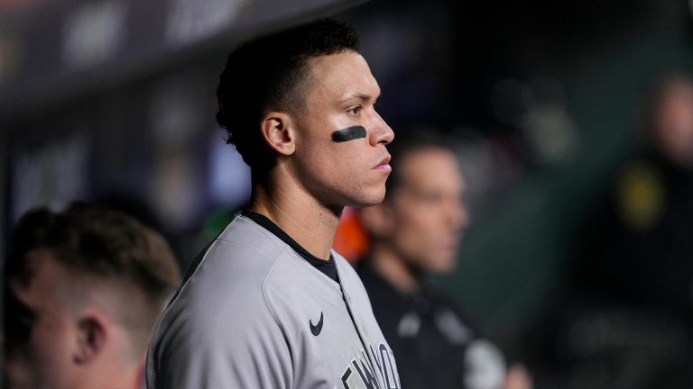 New York Yankees center fielder Aaron Judge (99) watches play from the dugout during the ninth inning in Game 1 of baseball's American League Championship Series between the Houston Astros and the New York Yankees. (Kevin M. Cox/AP)