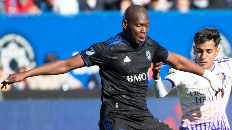 CF Montreal’s Kamal Miller, left, challenges Orlando City’s Facundo Torres during second half MLS soccer action in Montreal, Saturday, May 7, 2022. (Graham Hughes/CP)