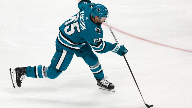 San Jose Sharks defenseman Erik Karlsson (65) takes a shot to score a goal against the Tampa Bay Lightning in the third period of an NHL hockey game, Saturday, Oct. 29, 2022, in San Jose, Calif. (Josie Lepe/AP)