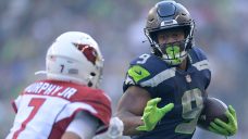 Walker runs for key TD, Seahawks beat Cardinals