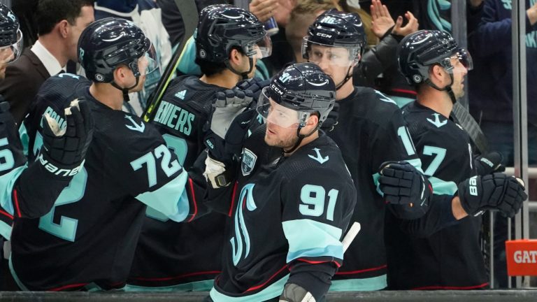 Seattle Kraken right wing Daniel Sprong (91) greets teammates after he scored a goal against the Ottawa Senators during the first period of an NHL hockey game. (Ted S. Warren/AP)