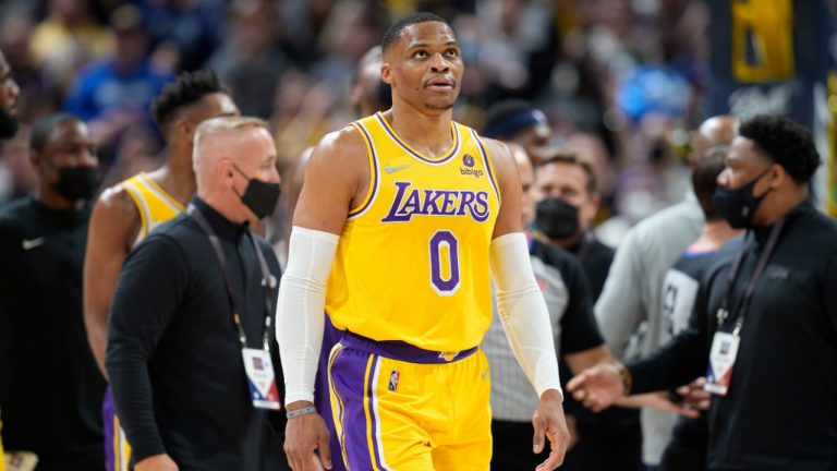 Los Angeles Lakers guard Russell Westbrook heads to the bench after exchanging words with Denver Nuggets forward Aaron Gordon in the second half of an NBA basketball game Saturday Jan. 15, 2022, in Denver. (AP Photo/David Zalubowski)