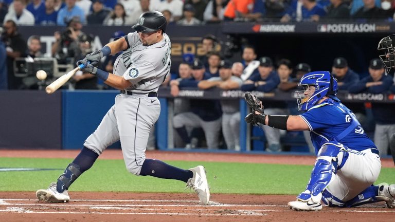 Seattle Mariners catcher Cal Raleigh (29) hits a two-run home run during first inning American League wild card MLB postseason baseball action against the Toronto Blue Jays in Toronto on Friday, October 7, 2022. (Nathan Denette/CP)