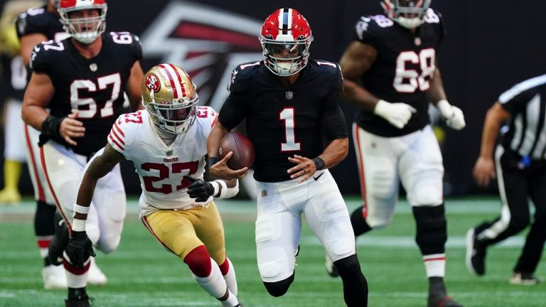 Atlanta Falcons quarterback Marcus Mariota (1) runs against San Francisco 49ers cornerback Dontae Johnson (27) during the first half of an NFL football game, Sunday, Oct. 16, 2022, in Atlanta. (John Bazemore/AP Photo)