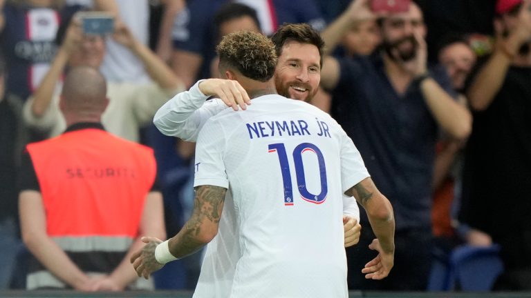 PSG's Neymar, left, celebrates with this teammate Lionel Messi after scoring his side's third goal during the French League One soccer match between Paris Saint-Germain and Troyes at the Parc des Princes in Paris, France, Saturday, Oct. 29, 2022. (AP Photo/Francois Mori)