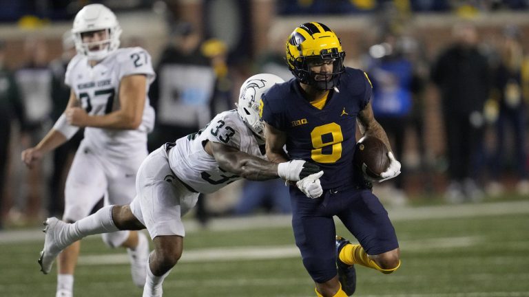 Michigan wide receiver Ronnie Bell (8) runs after a catch as Michigan State cornerback Kendell Brooks (33) defends in the second half of an NCAA college football game in Ann Arbor, Mich., Saturday, Oct. 29, 2022. (Paul Sancya/AP)