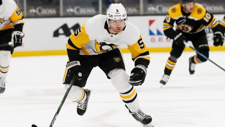 FILE - Pittsburgh Penguins' Mike Matheson plays during the second period of an NHL hockey game against the Boston Bruins in Boston, in this Thursday, April 1, 2021, file photo. In a way, the NHL's COVID-19 protocols may have been a blessing to the Pittsburgh Penguins. The rules forced the Penguins to basically hole up in the hotel while on the road, offering them time to build chemistry, one of the main reasons they were able to win their first division title in seven years. (Winslow Townson/AP)