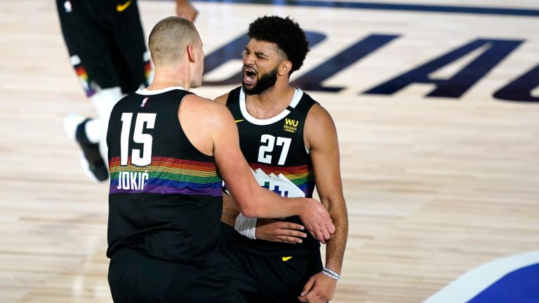 Denver Nuggets' Jamal Murray (27) and Nikola Jokic (15) react during overtime in an NBA basketball first round playoff game against the Utah Jazz. (Ashley Landis/AP)