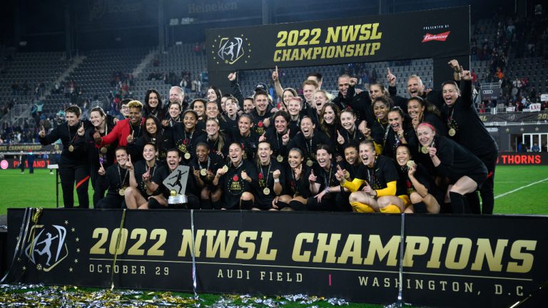 Portland Thorns FC pose with the trophy after they won the NWSL championship soccer match against the Kansas City Current. (Nick Wass/AP)