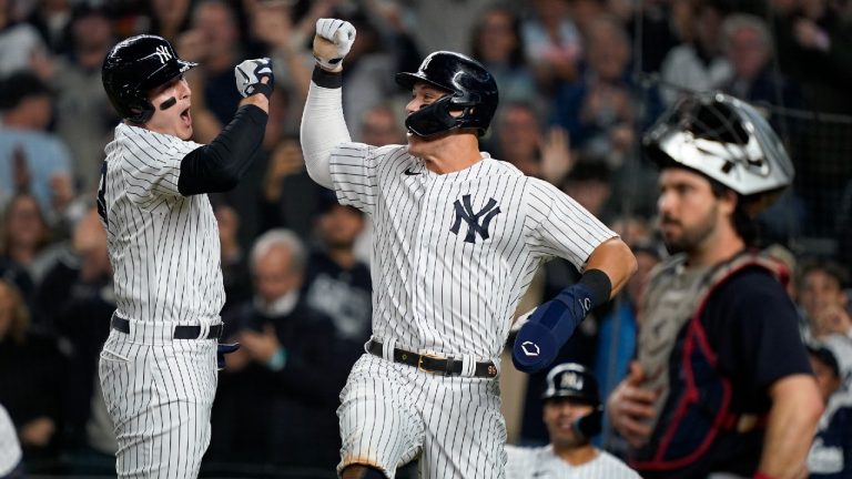 New York Yankees Anthony Rizzo, left, celebrates with Aaron Judge after hitting a two-run home run against the Cleveland Guardians during the sixth inning of Game 1 of an American League Division baseball series, Tuesday, Oct. 11, 2022, in New York. (John Minchillo/AP)