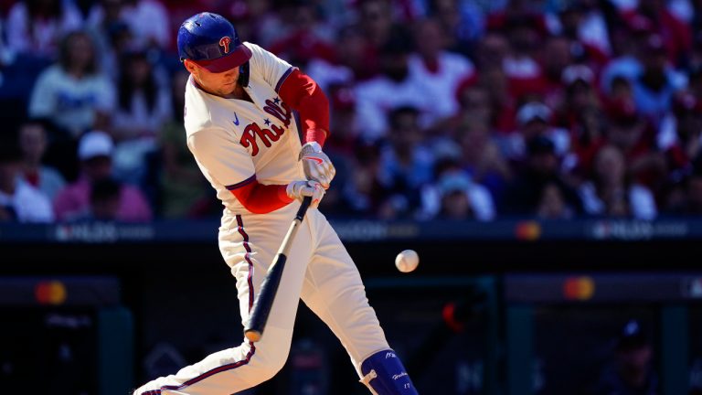 Philadelphia Phillies first baseman Rhys Hoskins (17) hits a single during the first inning in Game 4 of baseball's National League Division Series between the Philadelphia Phillies and the Atlanta Braves, Saturday, Oct. 15, 2022, in Philadelphia. (Matt Rourke/AP)