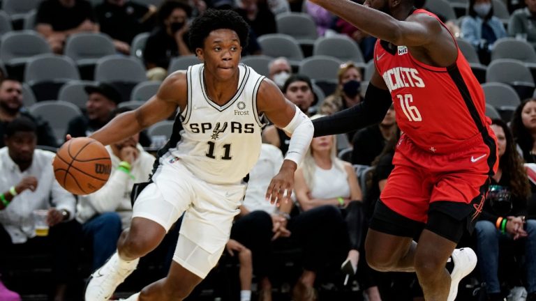 San Antonio Spurs' Josh Primo (11) drives against Houston Rockets' Usman Garuba during the second half of a preseason NBA basketball game, Friday, Oct. 15, 2021, in San Antonio. (Darren Abate/AP)