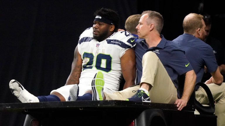 Seattle Seahawks running back Rashaad Penny is carted off the field during an NFL football game against the New Orleans Saints in New Orleans, Sunday, Oct. 9, 2022. (Gerald Herbert/AP)