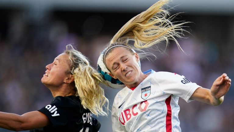 Angel City FC forward Claire Emslie (10) and Chicago Red Stars forward Rachel Hill, right, head the ball during the second half of an NWSL soccer match in Los Angeles, Sunday, Aug. 14, 2022. (Ashley Landis/AP Photo)