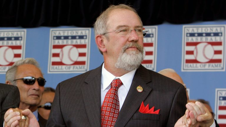 Baseball Hall of Fame inductee Bruce Sutter holds hands with others, as requested by "Buck" O'Neil during his talk about the Negro League, at induction ceremonies in Cooperstown, N.Y., July 30, 2006. Hall of Fame reliever and 1979 Cy Young winner Bruce Sutter has died. He was 69. Major League Baseball and the St. Louis Cardinals announced Sutter's death on Friday, Oct. 14, 2022, but did not provide the cause of death or where he died. The Baseball Hall of Fame says Sutter died Thursday. (Jim McKnight/AP, file)