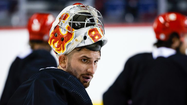 Calgary Flames goalie Dan Vladar takes a break during a training camp practice in Calgary, Alta., Thursday, Sept. 22, 2022. (Jeff McIntosh/CP)