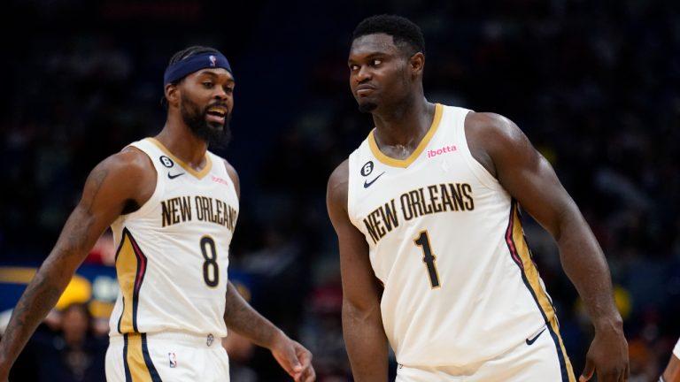 New Orleans Pelicans forward Zion Williamson (1) reacts with forward Naji Marshall (8) after being fouled in the act of scoring a basket in the second half of an NBA preseason basketball game against the Detroit Pistons. (Gerald Herbert/AP)