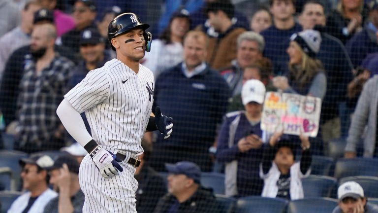 New York Yankees Aaron Judge comes off the field after grounding out against the Cleveland Guardians during the ninth inning of Game 2 of an American League Division baseball series, Friday, Oct. 14, 2022, in New York. (John Minchillo/AP)