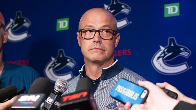 Vancouver Canucks general manager Patrik Allvin listens during a news conference about the NHL hockey team's free agency signings, in Vancouver, on Wednesday, July 13, 2022. THE CANADIAN PRESS/Darryl Dyck