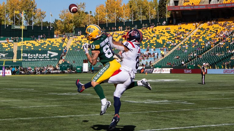 Montreal Alouettes Mike Jones (8) and Edmonton Elks Vincent Forbes-Mombleau (82) via for the ball during first half CFL action in Edmonton, Alta., on Saturday October 1, 2022. (Jason Franson/CP)