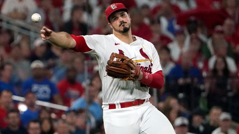 St. Louis Cardinals third baseman Nolan Arenado throws out Chicago Cubs' Nick Madrigal at first during the fifth inning of a baseball game Friday, Sept. 2, 2022, in St. Louis. (Jeff Roberson/AP)