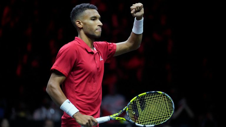 Team World's Felix Auger-Aliassime celebrates after winning a point against Team Europe's Andy Murray and Matteo Berrettini on final day of the Laver Cup tennis tournament at the O2 in London, Sunday, Sept. 25, 2022. (Kin Cheung/AP)