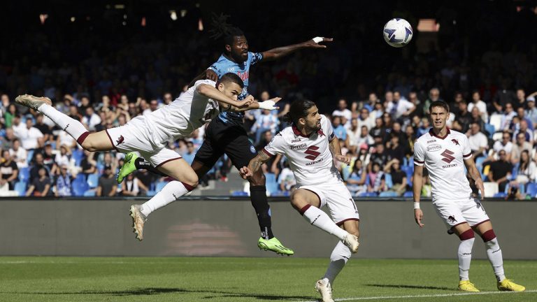 Napoli's Andre Zambo Anguissa, second left, scores his side's opening goal during the Serie A soccer match between Napoli and Torino, at the Diego Armando Maradona stadium in Naples, Italy, Saturday, Oct. 1, 2022. (Alessandro Garofalo/LaPresse via AP)