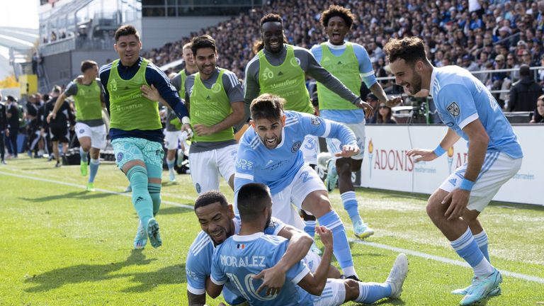 Teammates pile up on New York City midfielder Maximiliano Moralez following his goal against CF Montreal during first half Eastern Conference semifinals MLS action in Montreal on Sunday, October 23, 2022. (Paul Chiasson/CP)