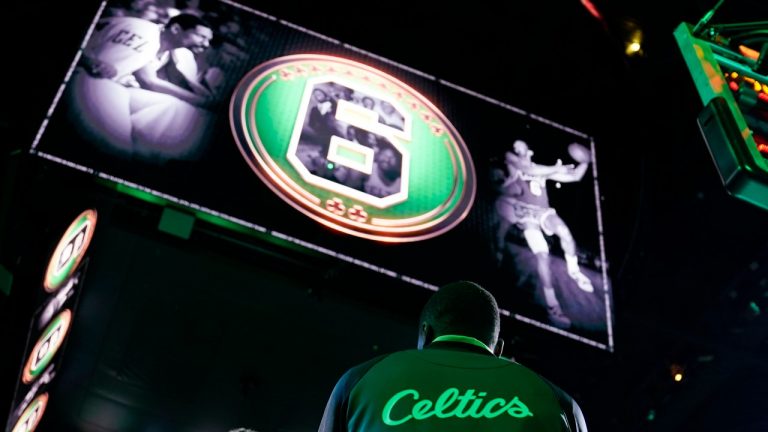 Hall of Famer and former Boston Celtics great Bill Russell is honored prior to an NBA basketball game between the Boston Celtics and Philadelphia 76ers, Tuesday, Oct. 18, 2022, in Boston. Russell died in July. (AP Photo/Charles Krupa)