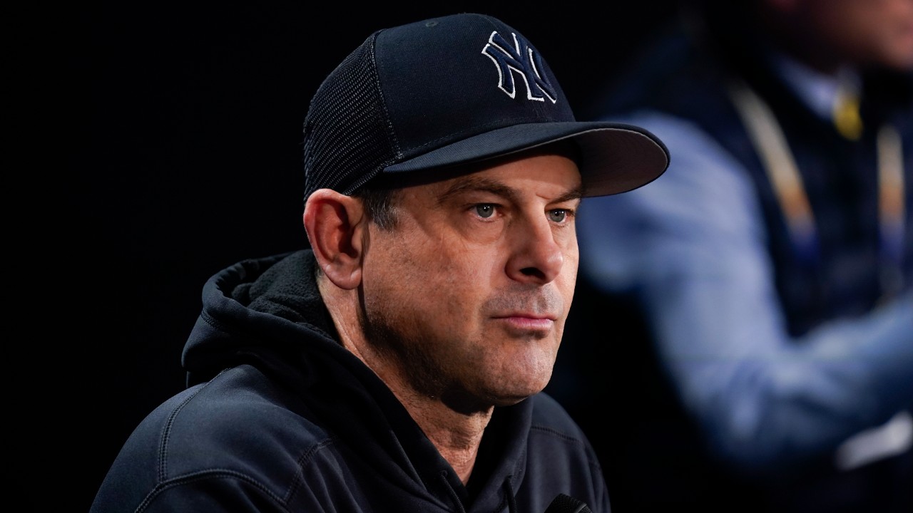 Bald guy stands in dugout. Also pictured: Aaron Boone @nypost