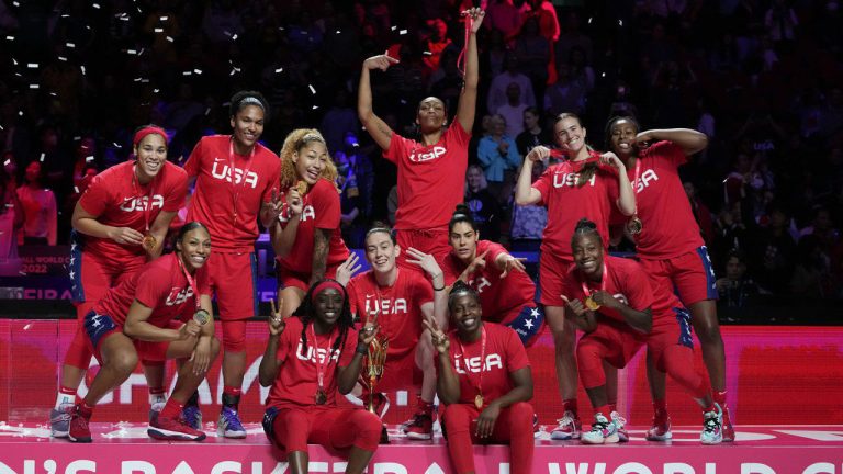 Gold medalists the United States celebrate on the podium after defeating China in the final at the women's Basketball World Cup. (Mark Baker/AP)